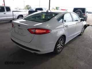 2016 Ford Fusion SE with VIN 3FA6P0H71GR386404, listed as a IAAI auction lot 41974062 with 104,018 mi miles. Bid and sale history available at carsss.com. Image 4.