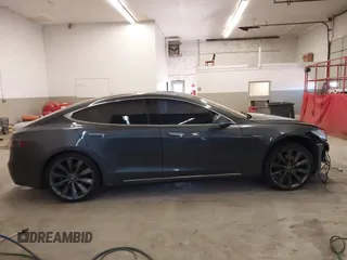 2014 Tesla Model S 60 with VIN 5YJSA1H13EFP49912, listed as a IAAI auction lot 41716661 with 129,776 mi miles and . Bid and sale history available at DreamBid. Image 14.