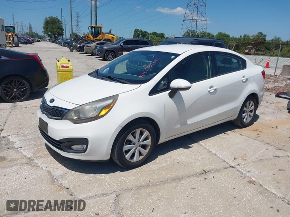 2013 Kia Rio SX with VIN KNADN4A33D6174454, listed as a IAAI auction lot 42032612 with 157,199 mi miles. Bid and sale history available at carsss.com. Image 2.