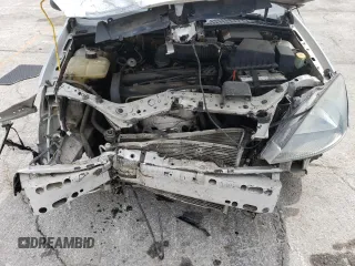 2004 Ford Focus SE with VIN 1FAFP34344W113759, listed as a Copart auction lot 51386335 with 148,267 mi miles and Salvage title. Bid and sale history available at DreamBid. Image 13.