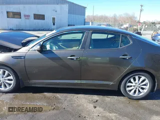 2014 Kia Optima EX z VIN 5XXGN4A78EG320367, wystawiony jako IAAI lot #41858824 z przebiegiem 216 987 mil mil oraz . Historia ofert i sprzedaży dostępna na DreamBid. Obrazek 14.