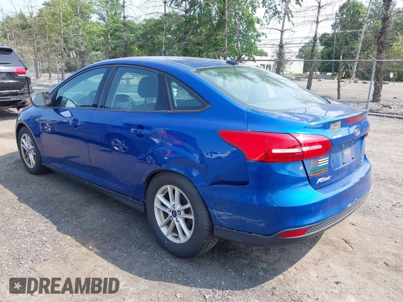 2018 Ford Focus SE z VIN 1FADP3FE1JL254632, wystawiony jako IAAI lot #42408683 z przebiegiem 74 696 mil mil oraz . Historia ofert i sprzedaży dostępna na DreamBid. Obrazek 3.