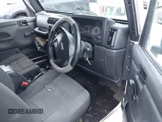 2006 Jeep Wrangler Sport Right Hand Drive with VIN 1J4F449S16P709895, listed as a IAAI auction lot 41349311 with 157,125 mi miles. Bid and sale history available at carsss.com. Image 5.