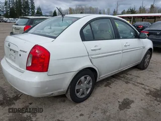 2007 Hyundai Accent GLS with VIN KMHCN46C67U097159, listed as a IAAI auction lot 41913373 with 103,303 mi miles. Bid and sale history available at carsss.com. Image 4.