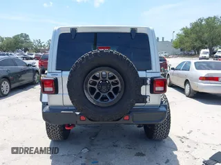 2023 Jeep Wrangler Rubicon with VIN 1C4JJXFG0PW522651, listed as a IAAI auction lot 42112210 with 7,744 mi miles and . Bid and sale history available at carsss.com. Image 17.