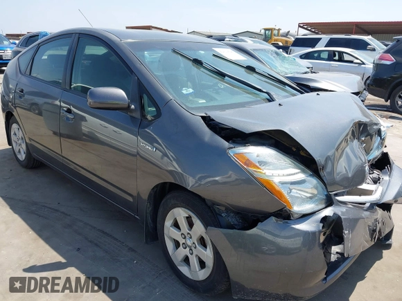 2007 Toyota Prius z VIN JTDKB20U173242693, wystawiony jako IAAI lot #42310546 z przebiegiem 250 887 mil mil oraz . Historia ofert i sprzedaży dostępna na DreamBid. Obrazek 1.