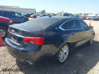 2014 Chevrolet Impala LTZ with VIN 2G1155S31E9254137, listed as a IAAI auction lot 41986102 with 184,296 mi miles. Bid and sale history available at carsss.com. Image 4.