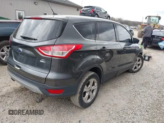 2016 Ford Escape SE with VIN 1FMCU9GX8GUB21396, listed as a IAAI auction lot 41940242 with 123,943 mi miles. Bid and sale history available at carsss.com. Image 4.