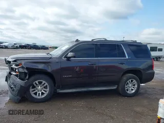 2015 Chevrolet Tahoe LT with VIN 1GNSCBKC2FR632173, listed as a IAAI auction lot 42135105 with 150,033 mi miles and . Bid and sale history available at DreamBid. Image 14.