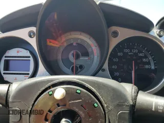 2011 Nissan 370Z Touring z VIN JN1AZ4EH7BM551606, wystawiony jako Copart lot #57173945 z przebiegiem Nie podano mil oraz Szkoda całkowita • Salvage title. Historia ofert i sprzedaży dostępna na DreamBid. Obrazek 9.