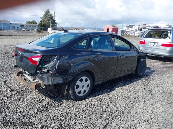 2014 Ford Focus S with VIN 1FADP3E29EL176811, listed as a IAAI auction lot 41808719 with 84,600 mi miles. Bid and sale history available at carsss.com. Image 4.