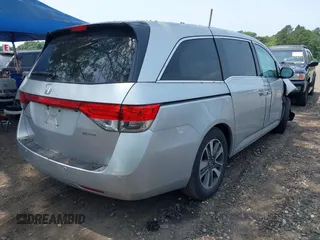 2014 Honda Odyssey Touring with VIN 5FNRL5H97EB054158, listed as a IAAI auction lot 42548360 with 91,161 mi miles and . Bid and sale history available at DreamBid. Image 4.