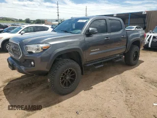 2018 Toyota Tacoma SR with VIN 3TMCZ5AN7JM186967, listed as a Copart auction lot 61829535 with 134,799 mi miles and Salvage title. Bid and sale history available at DreamBid. Image 1.