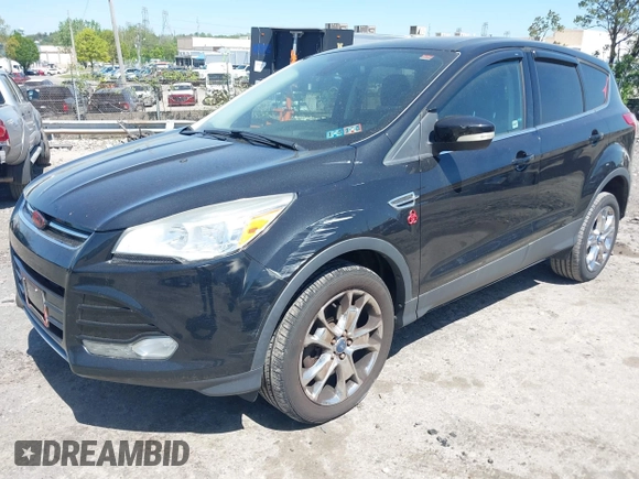 2013 Ford Escape SEL with VIN 1FMCU9H97DUA51529, listed as a IAAI auction lot 42164245 with 106,649 mi miles and . Bid and sale history available at DreamBid. Image 6.
