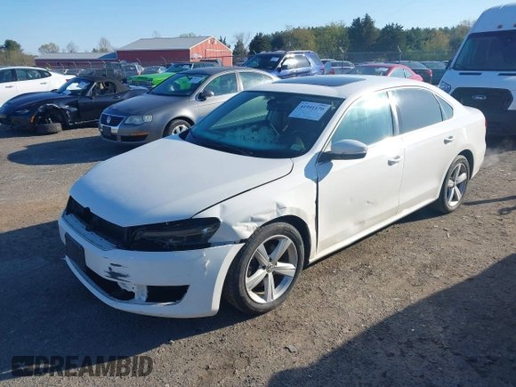 2013 Volkswagen Passat SE w/Sunroof & Nav with VIN 1VWBP7A32DC017647, listed as a IAAI auction lot 41991170 with 270,917 mi miles. Bid and sale history available at carsss.com. Image 2.