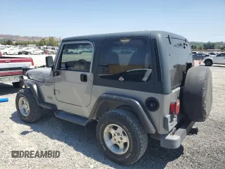 2000 Jeep Wrangler SE with VIN 1J4FA29P7YP737289, listed as a Copart auction lot 61869865 with 91,097 mi miles and Salvage title. Bid and sale history available at DreamBid. Image 2.
