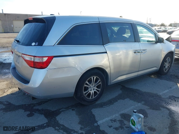 2011 Honda Odyssey EX-L with VIN 5FNRL5H6XBB057556, listed as a IAAI auction lot 41808620 with 154,449 mi miles. Bid and sale history available at carsss.com. Image 4.