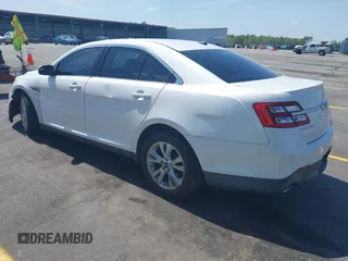 2014 Ford Taurus SEL with VIN 1FAHP2E86EG132676, listed as a IAAI auction lot 41943392 with 183,633 mi miles. Bid and sale history available at carsss.com. Image 3.
