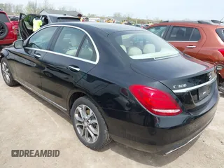 2015 Mercedes-Benz C with VIN 55SWF4KBXFU040013, listed as a IAAI auction lot 42136894 with 123,460 mi miles. Bid and sale history available at carsss.com. Image 3.