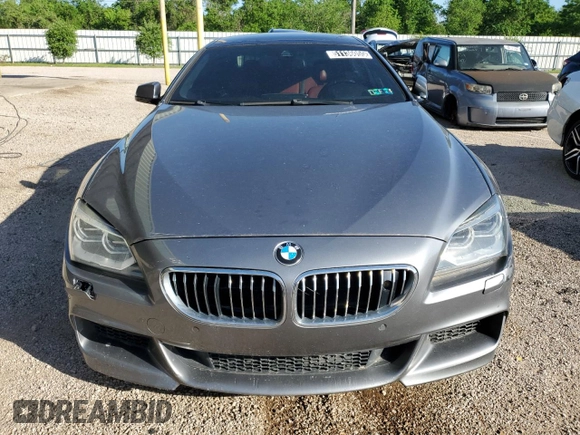 2014 BMW 6 Series 650i xDrive z VIN WBA6B4C53ED371461, wystawiony jako Copart lot #51136055 z przebiegiem 143 213 mil mil oraz Tytuł czysty. Historia ofert i sprzedaży dostępna na DreamBid. Obrazek 5.