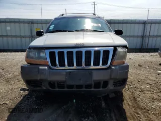 2000 Jeep Grand Cherokee Laredo z VIN 1J4GW48N9YC239166, wystawiony jako Copart lot #53321135 z przebiegiem 142 162 mil mil oraz Szkoda całkowita • Salvage title. Historia ofert i sprzedaży dostępna na DreamBid. Obrazek 5.