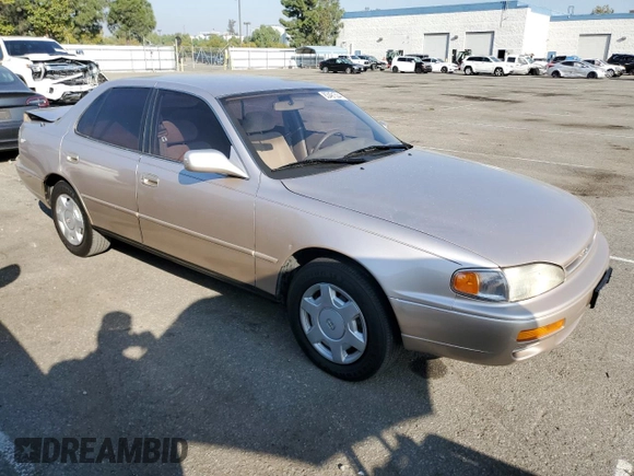 1995 Toyota Camry LE with VIN JT2GK12E7S0107467, listed as a Copart auction lot 83491534 with 112,971 mi miles and Salvage Title. Bid and sale history available at carsss.com. Image 4.