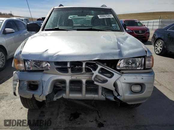 2000 Isuzu Rodeo z VIN 4S2DM58W8Y4331154, wystawiony jako Copart lot #49507535 z przebiegiem 198 476 mil mil oraz Szkody całkowita. Historia ofert i sprzedaży dostępna na DreamBid. Obrazek 5.