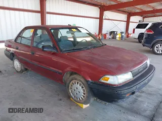 1990 Toyota Corolla z VIN 1NXAE94A1LZ117401, wystawiony jako IAAI lot #41755431 z przebiegiem 81 786 mil mil oraz . Historia ofert i sprzedaży dostępna na DreamBid. Obrazek 1.