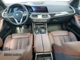 2019 BMW X5 xDrive40i with VIN 5UXCR6C5XKLK80703, listed as a Copart auction lot 63473495 with 57,260 mi miles and Salvage title. Bid and sale history available at DreamBid. Image 8.