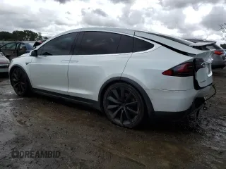 2016 Tesla Model X 70D with VIN 5YJXCAE28GF017100, listed as a Copart auction lot 50081235 with 126,962 mi miles and Salvage Title. Bid and sale history available at DreamBid. Image 2.