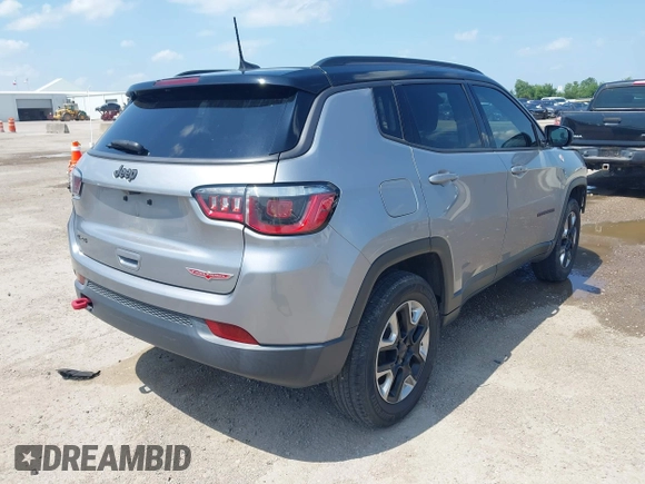 2018 Jeep Compass Trailhawk with VIN 3C4NJDDB2JT198784, listed as a IAAI auction lot 42405539 with 121,553 mi miles and . Bid and sale history available at DreamBid. Image 4.