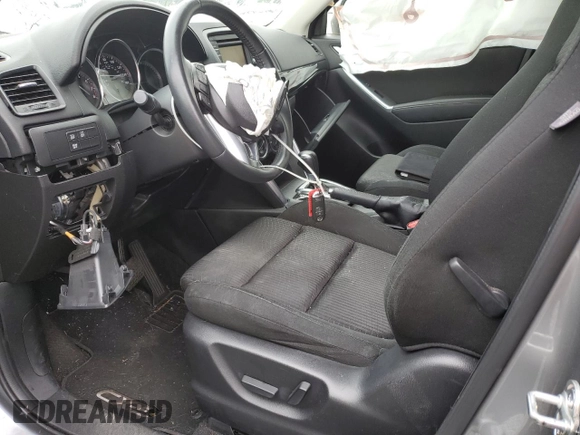 2014 Mazda CX-5 Touring z VIN JM3KE4CYXE0426408, wystawiony jako Copart lot #57355115 z przebiegiem Nie podano mil oraz Szkody całkowita. Historia ofert i sprzedaży dostępna na DreamBid. Obrazek 7.
