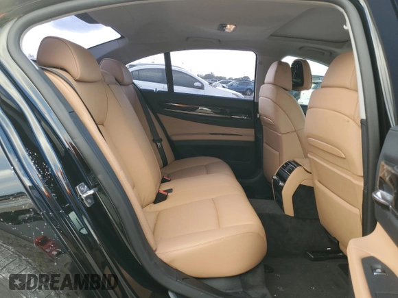 2011 BMW 7 Series 740i with VIN WBAKA4C59BC392351, listed as a Copart auction lot 84942304 with 76,874 mi miles and Salvage Title. Bid and sale history available at carsss.com. Image 10.
