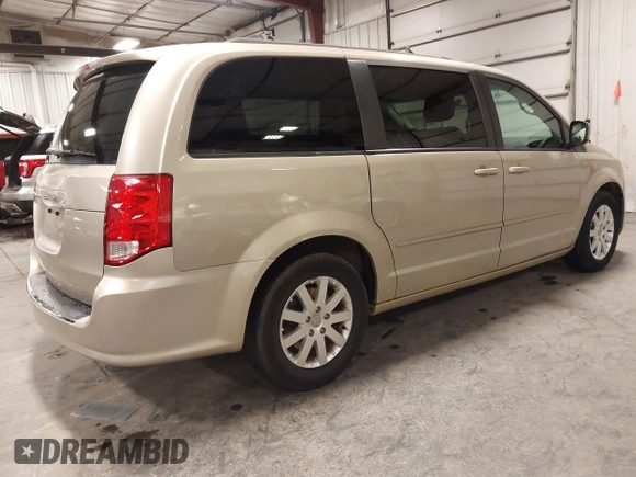 2013 Dodge Grand Caravan SXT with VIN 2C4RDGCG0DR567186, listed as a IAAI auction lot 41706119 with 112,512 mi miles and . Bid and sale history available at DreamBid. Image 4.