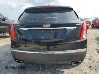 2017 Cadillac XT5 FWD with VIN 1GYKNARS0HZ283618, listed as a Copart auction lot 61640005 with 113,823 mi miles and Salvage title. Bid and sale history available at DreamBid. Image 6.