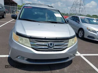 2011 Honda Odyssey Touring with VIN 5FNRL5H99BB058448, listed as a IAAI auction lot 42651432 with 208,581 mi miles and . Bid and sale history available at DreamBid. Image 12.