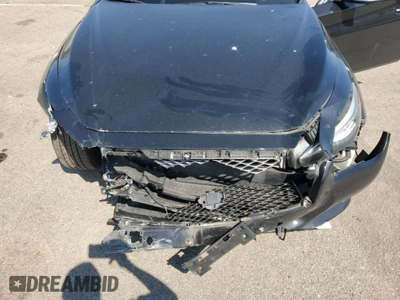 2015 Infiniti Q50 Premium with VIN JN1BV7ARXFM406453, listed as a Copart auction lot 54661515 with 77,298 mi miles and Salvage Title. Bid and sale history available at carsss.com. Image 11.