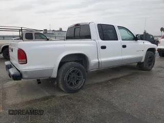 2002 Dodge Dakota SLT z VIN 1B7HL48N22S636413, wystawiony jako Copart lot #47884475 z przebiegiem 226 723 mil mil oraz Czysty tytuł • Clean title. Historia ofert i sprzedaży dostępna na DreamBid. Obrazek 3.