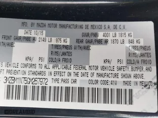 2016 Mazda Mazda3 i Grand Touring with VIN 3MZBM1N75GM267972, listed as a IAAI auction lot 41030060 with 86,065 mi miles. Bid and sale history available at carsss.com. Image 9.