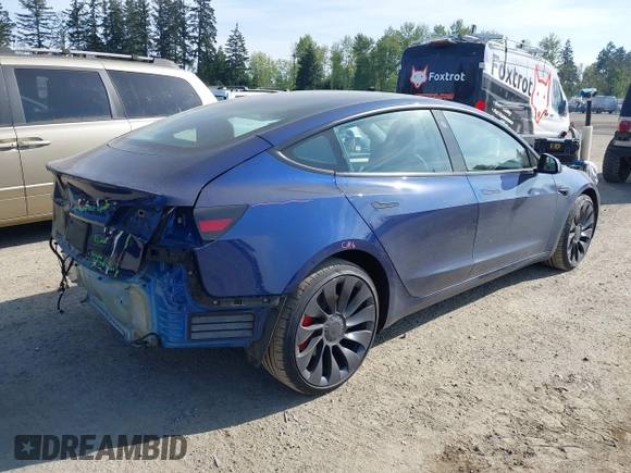 2023 Tesla Model 3 Performance with VIN 5YJ3E1EC2PF679613, listed as a IAAI auction lot 42099199 with 21,721 mi miles. Bid and sale history available at carsss.com. Image 4.