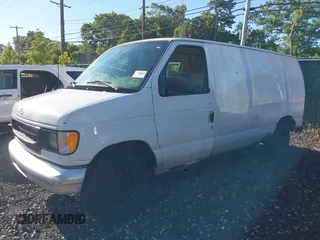 2002 Ford Econoline Cargo with VIN 1FTRE142X2HA95262, listed as a IAAI auction lot 39771693 with 204,642 mi miles. Bid and sale history available at carsss.com. Image 2.