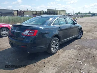 2014 Ford Taurus Limited z VIN 1FAHP2F85EG125118, wystawiony jako IAAI lot #42457437 z przebiegiem 129 406 mil mil oraz . Historia ofert i sprzedaży dostępna na DreamBid. Obrazek 4.