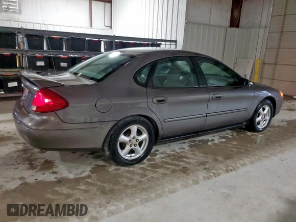 2002 Ford Taurus SES Standard z VIN 1FAFP55U72A161401, wystawiony jako Copart lot #55893125 z przebiegiem 128 258 mil mil oraz Czysty tytuł • Clean title. Historia ofert i sprzedaży dostępna na DreamBid. Obrazek 3.
