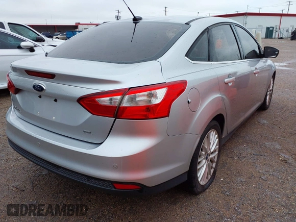 2012 Ford Focus SEL with VIN 1FAHP3H22CL102110, listed as a IAAI auction lot 41963966 with 151,538 mi miles. Bid and sale history available at carsss.com. Image 4.