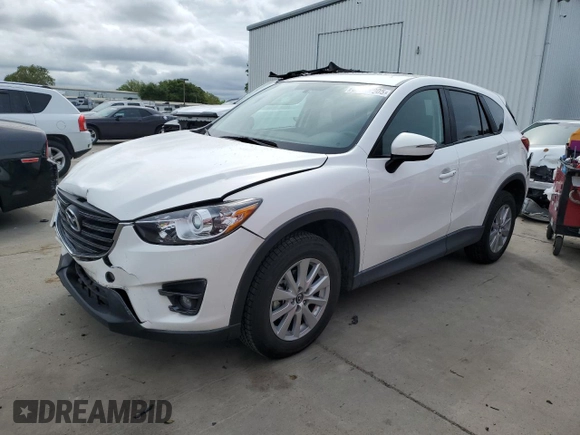 2016 Mazda CX-5 Touring with VIN JM3KE2CYXG0777715, listed as a Copart auction lot 52157005 with 58,585 mi miles and Salvage Title. Bid and sale history available at carsss.com. Image 1.