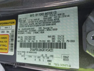 2016 Ford Fusion SE Hybrid z VIN 3FA6P0LU6GR145421, wystawiony jako IAAI lot #42650918 z przebiegiem 105 990 mil mil oraz . Historia ofert i sprzedaży dostępna na DreamBid. Obrazek 9.