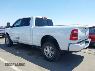 2023 Ram 2500 Laramie with VIN 3C6UR5FL2PG559276, listed as a IAAI auction lot 42281324 with 23,526 mi miles and . Bid and sale history available at DreamBid. Image 3.