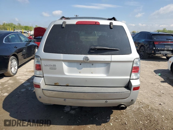 2009 Mercury Mariner Premier z VIN 4M2CU87769KJ11358, wystawiony jako Copart lot #55577235 z przebiegiem 206 627 mil mil oraz Szkody całkowita. Historia ofert i sprzedaży dostępna na DreamBid. Obrazek 6.