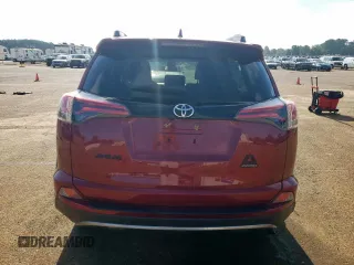 2018 Toyota RAV4 XLE with VIN 2T3RFREV7JW818661, listed as a Copart auction lot 65756615 with 56,369 mi miles and Salvage title. Bid and sale history available at DreamBid. Image 6.