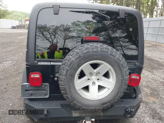 2006 Jeep Wrangler Rubicon z VIN 1J4FA69S76P749712, wystawiony jako IAAI lot #42240375 z przebiegiem 75 405 mil mil oraz . Historia ofert i sprzedaży dostępna na DreamBid. Obrazek 16.